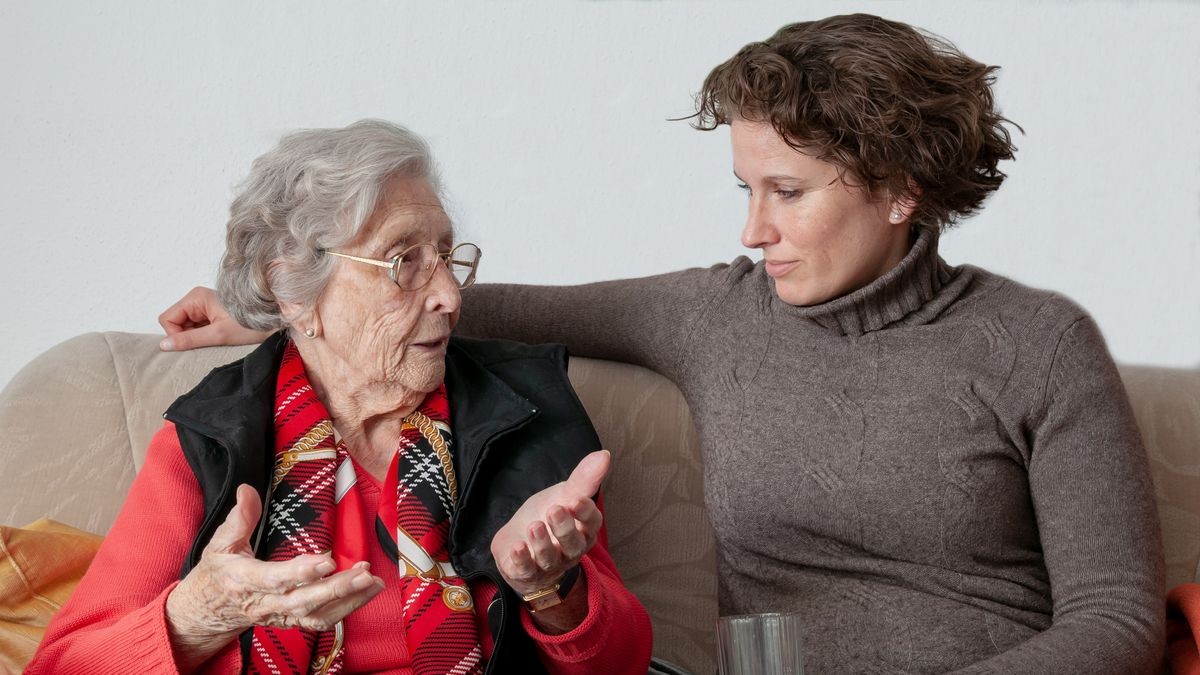 Senior woman and young woman talking